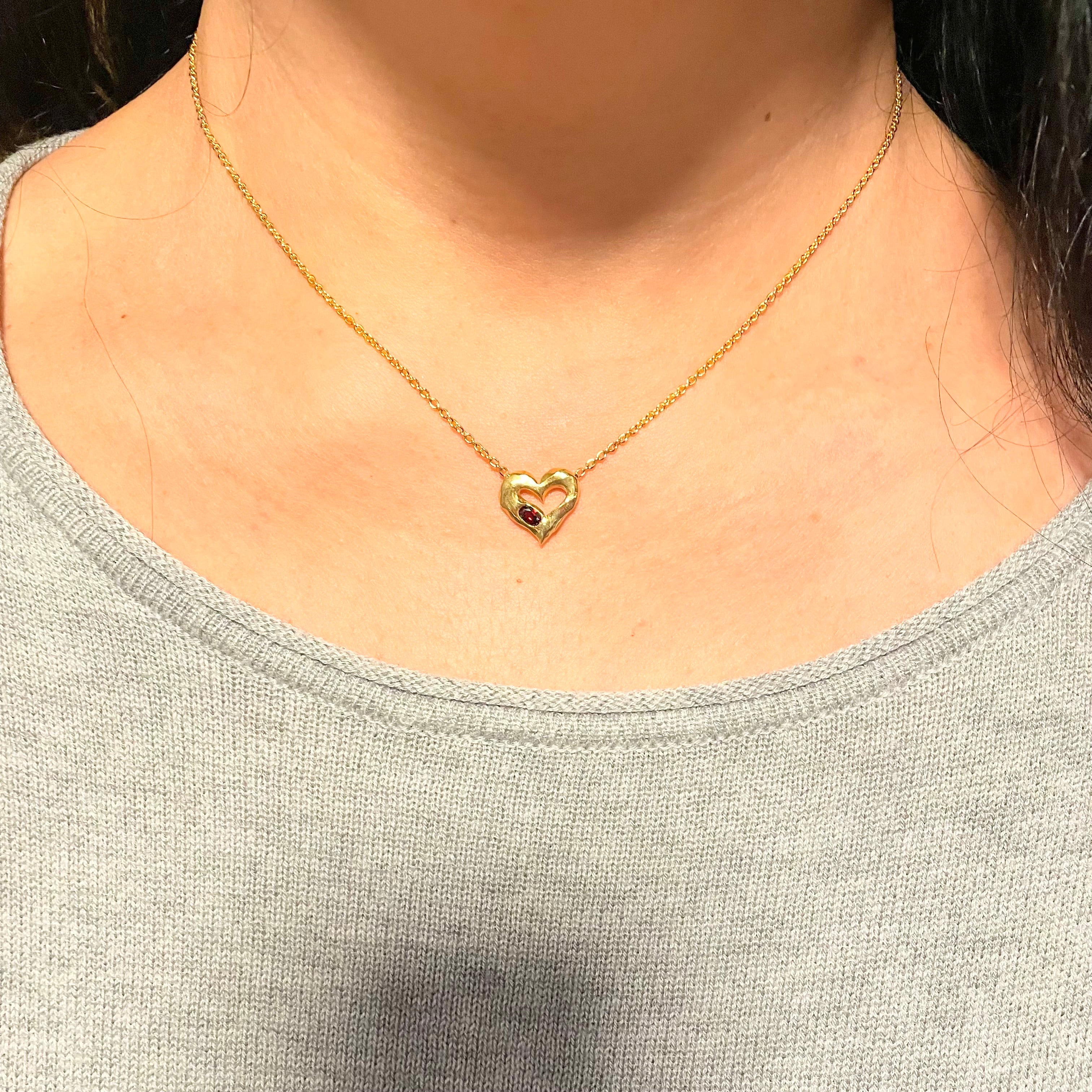18k Gold Vermeil Red Garnet Heart Necklace by Amy Delson shown on model