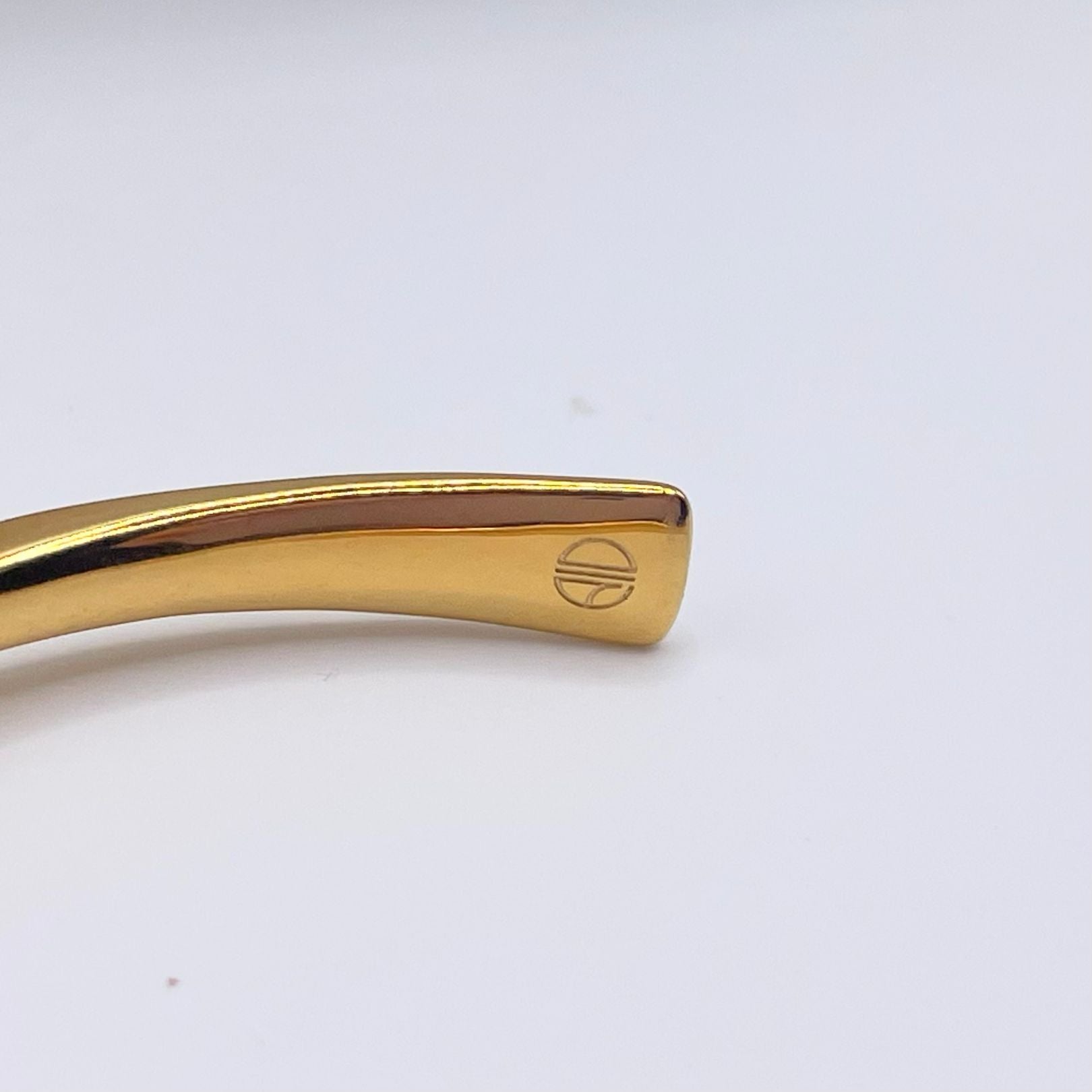 Amy Delson Jewelry logo detail inside gold cuff bracelet