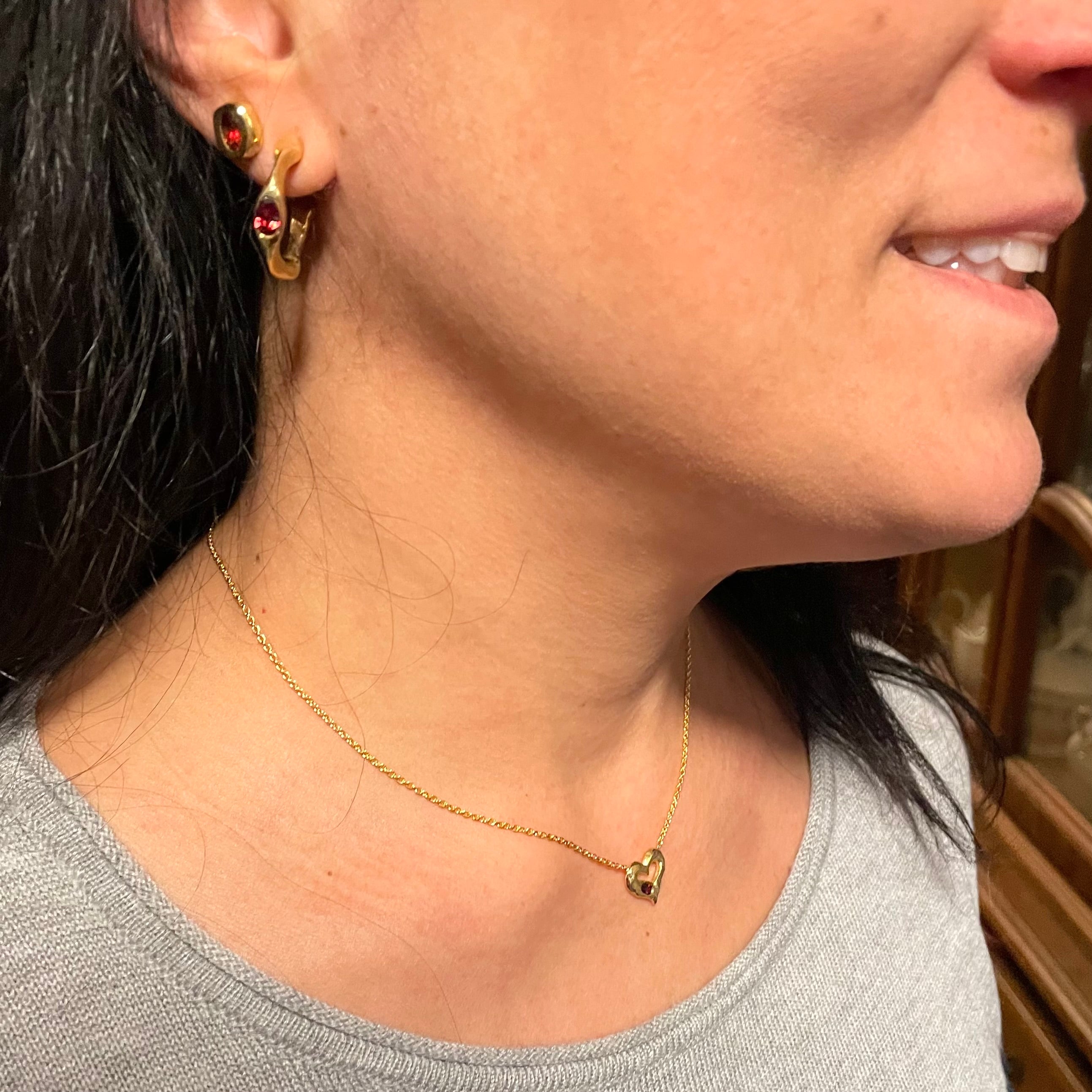 Amy Delson Red Garnet 18k Gold Vermeil earrings and heart necklace on model