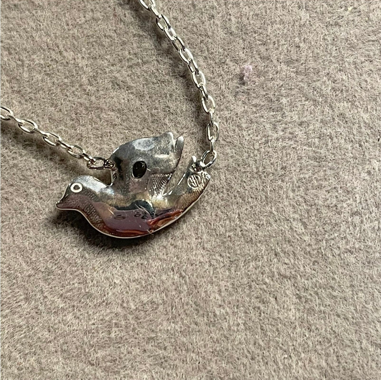 Back of Sterling Silver Dove necklace with White Topaz by Amy Delson