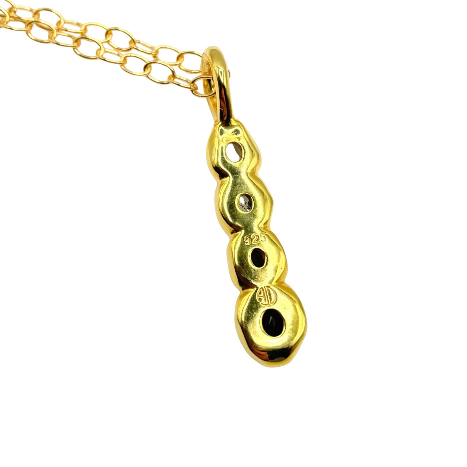 Back view of Amy Delson Onyx White Topaz Smoky Quartz Olivia Pendant Necklace in Gold