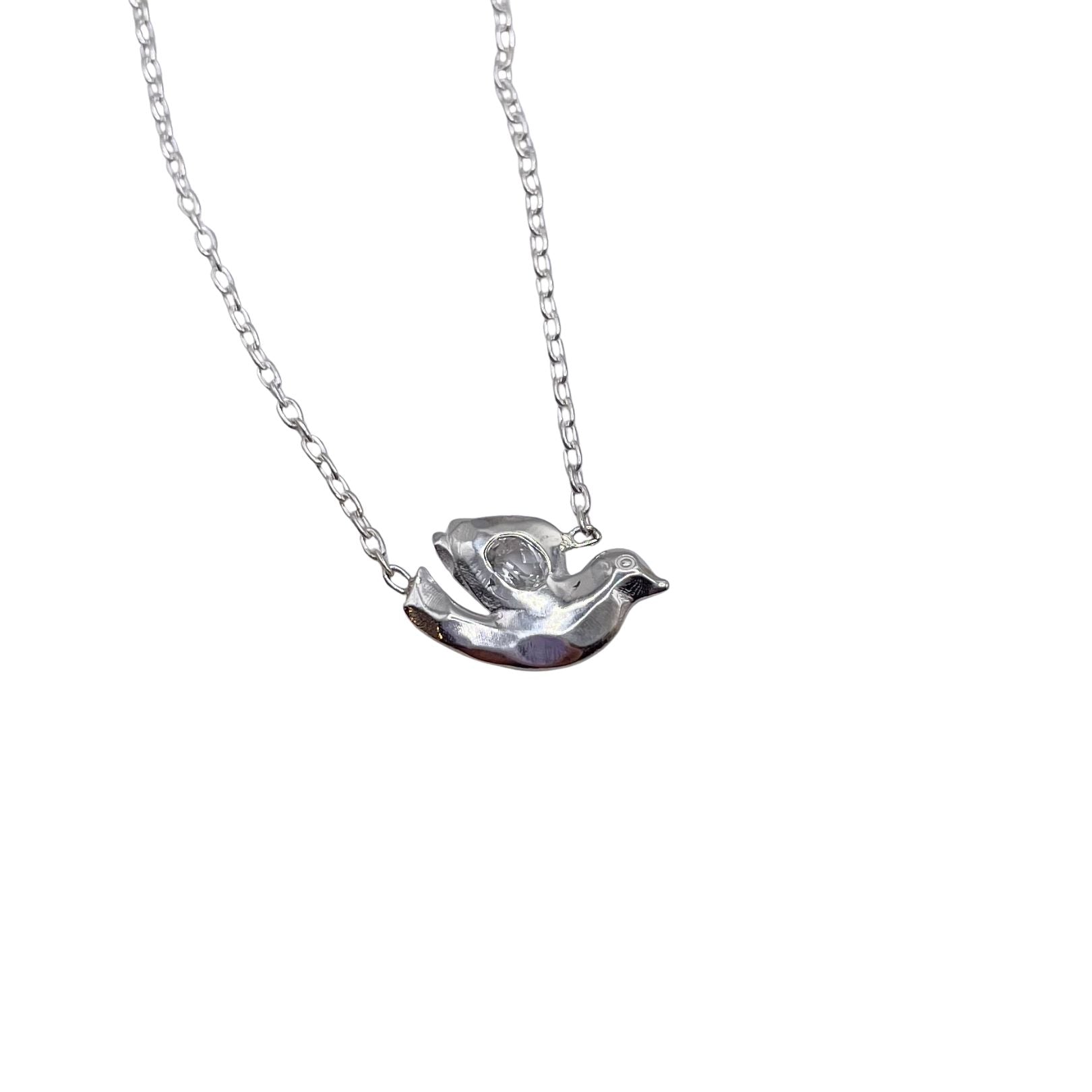 Closeup detail of Sterling Silver and Dove necklace with White Topaz by Amy Delson