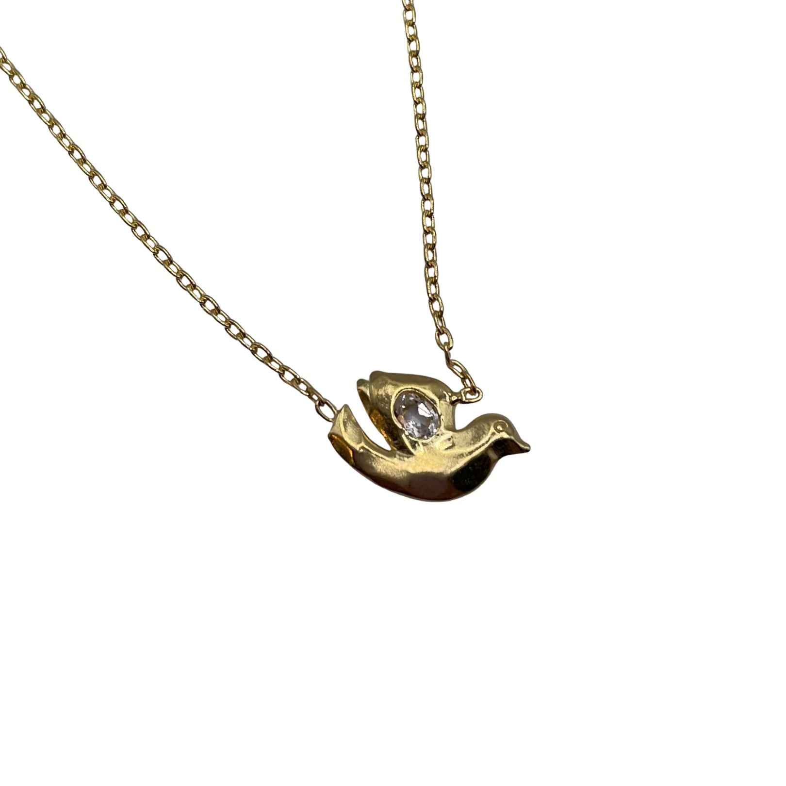 Closeup of 18k Gold Vermeil with White Topaz Dove necklace by Amy Delson