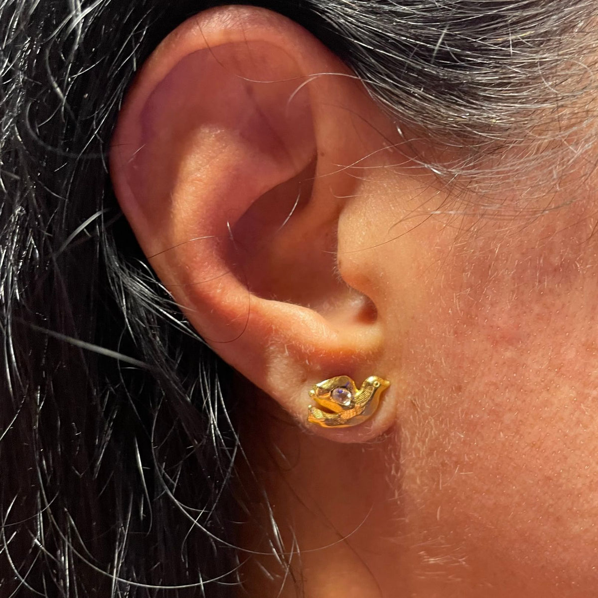 Gold white topaz stud by Amy Delson on ear