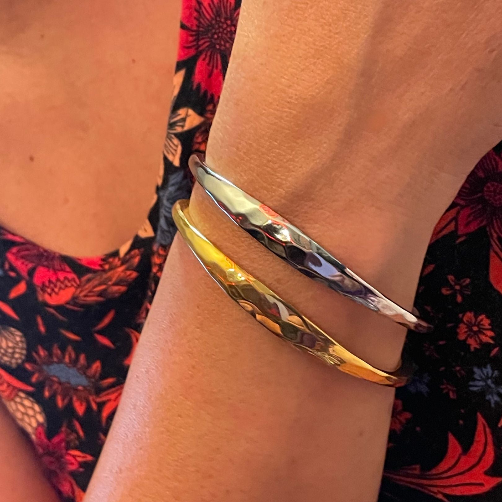 Gold and Silver forged cuffs by Amy Delson on wrist