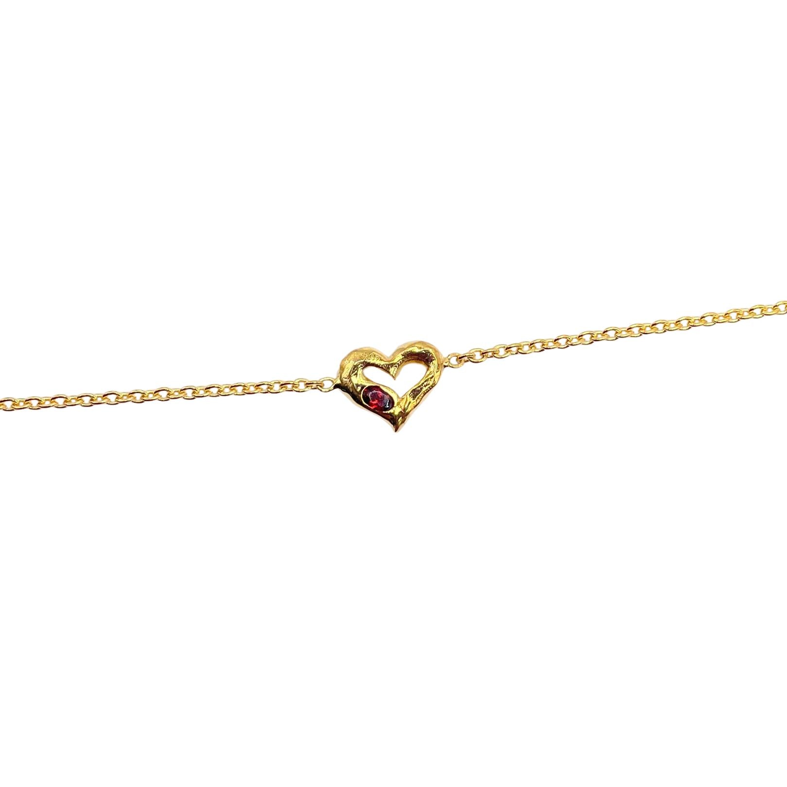 Gold heart with red garnet bracelet by Amy Delson