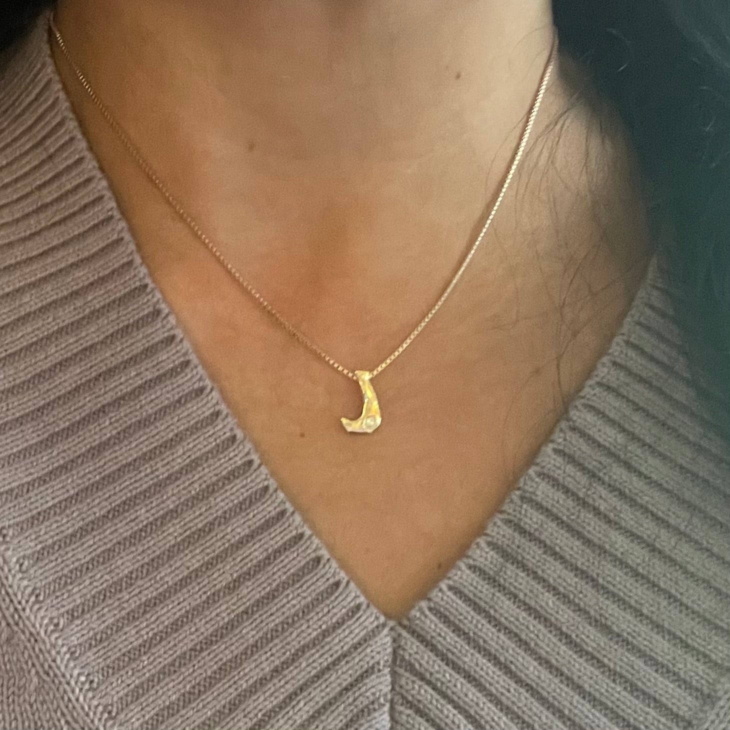 Gold Letter J by Amy Delson shown on a model