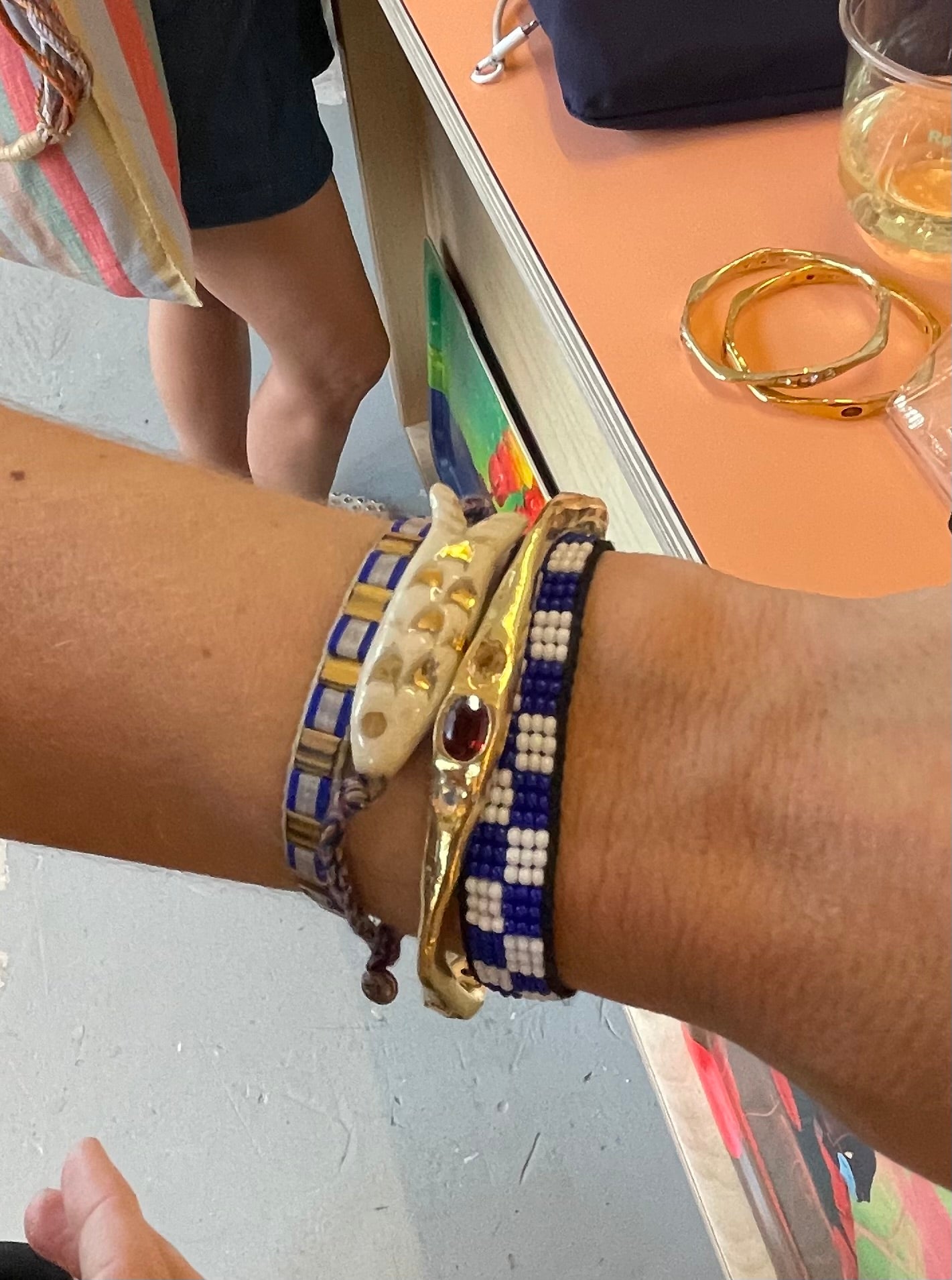 Amy Delson Garnet Citrine bangle on wrist with bracelet stack