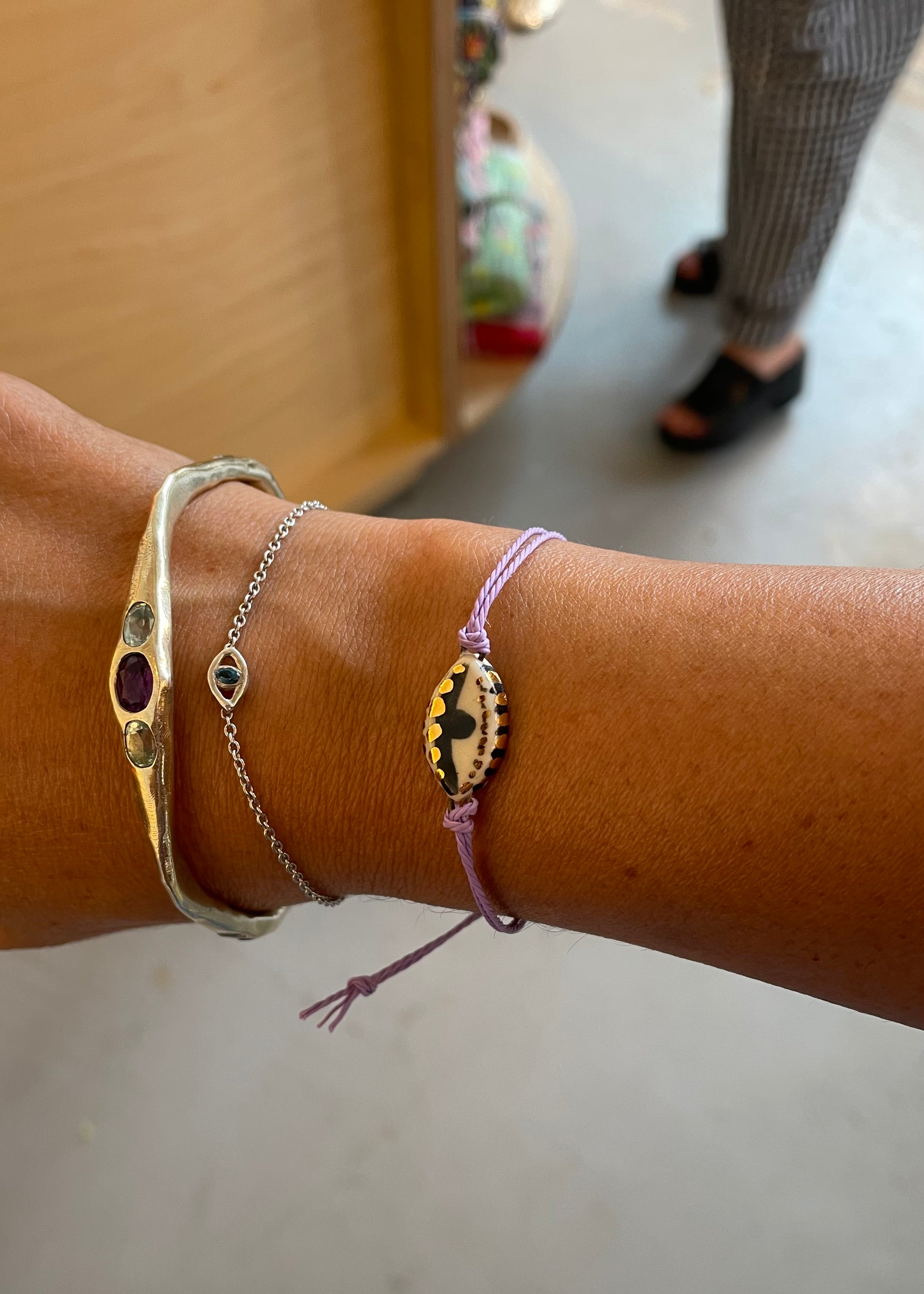 Amy Delson Bella bangle shown in stack with Eyela Bracelet.