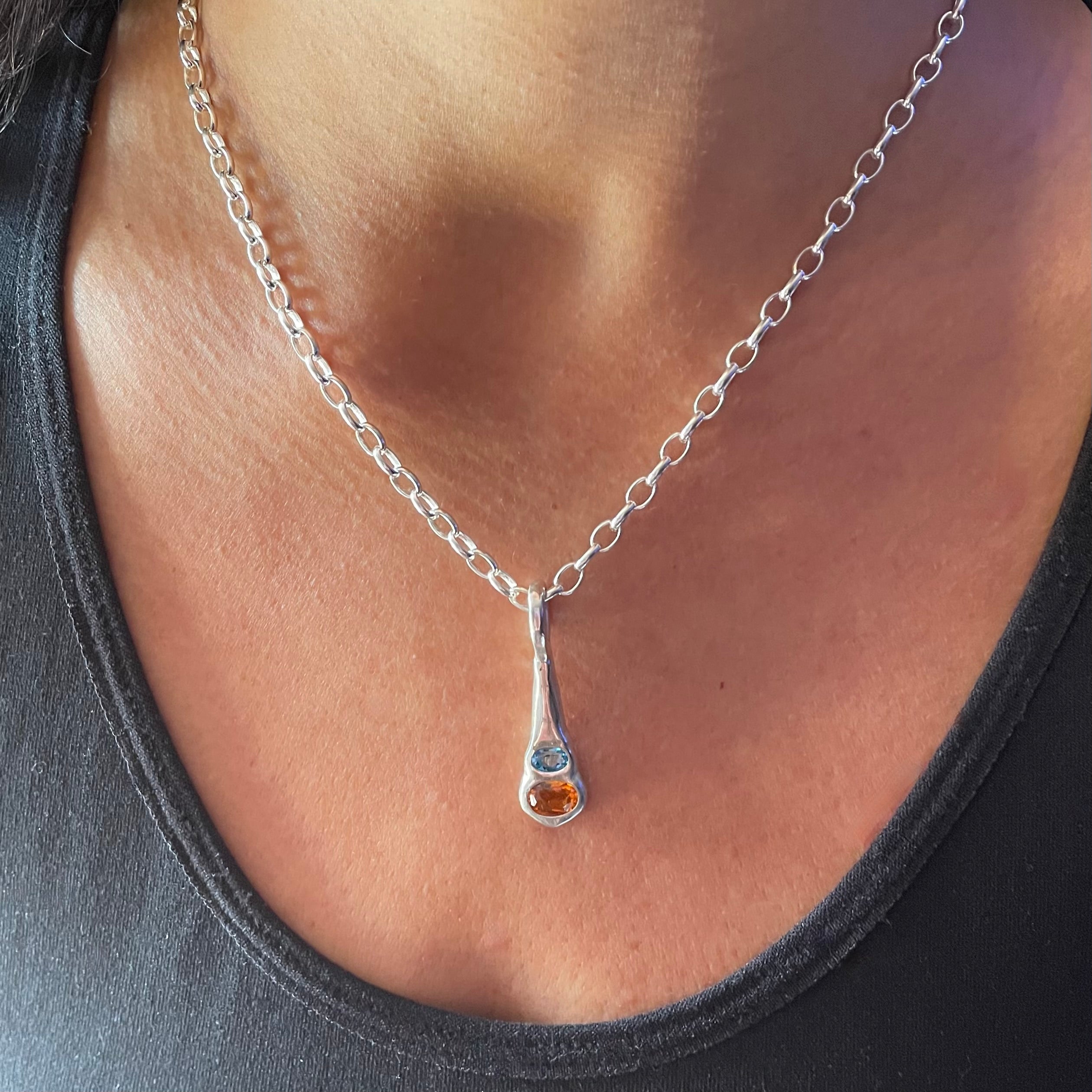 Amy Delson Orange citrine silver pendant necklace shown on the neck