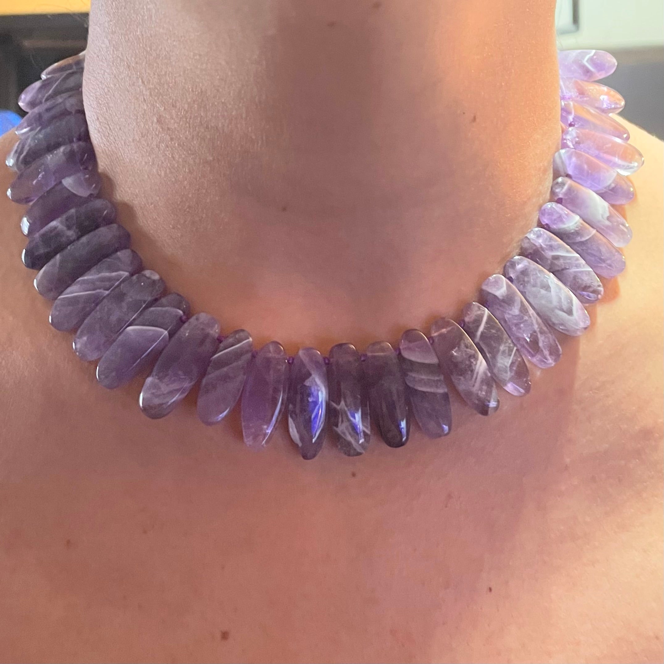 Model wears Amethyst choker toggle necklace by Amy Delson