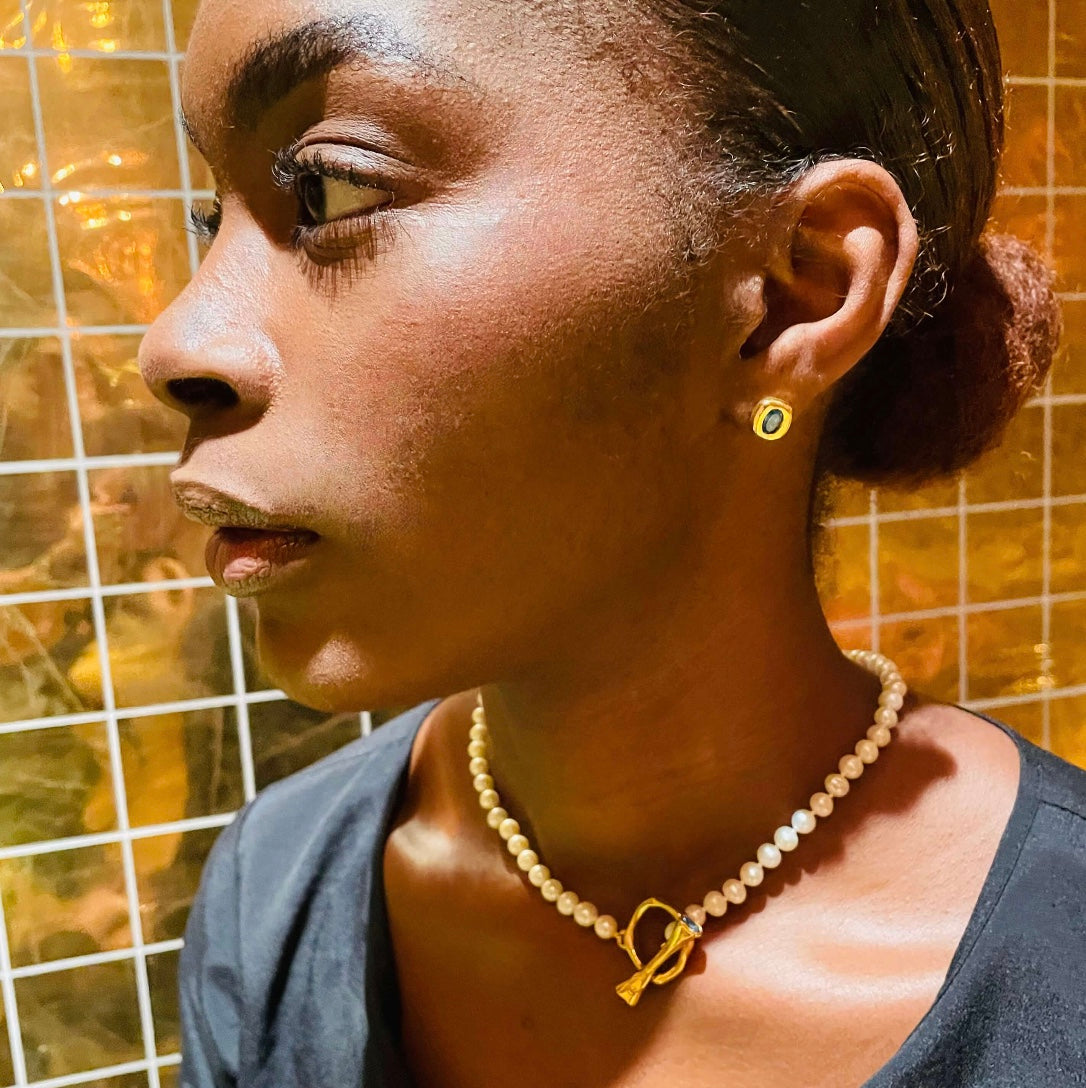 Model wears Pearl Necklace with Gold toggle clasp by Amy Delson