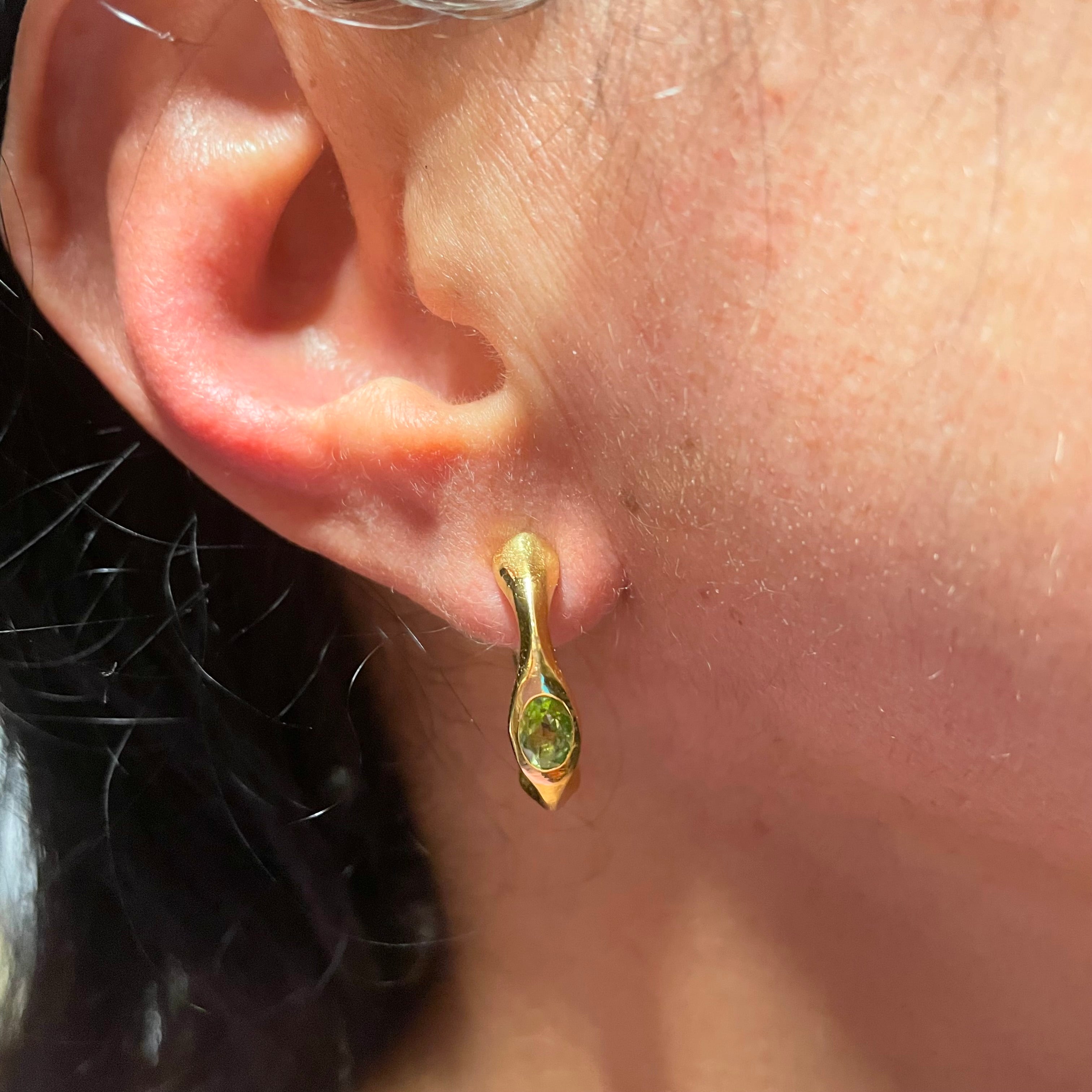 On ear, Green Peridot Gold vermeil hoop earrings by Amy Delson