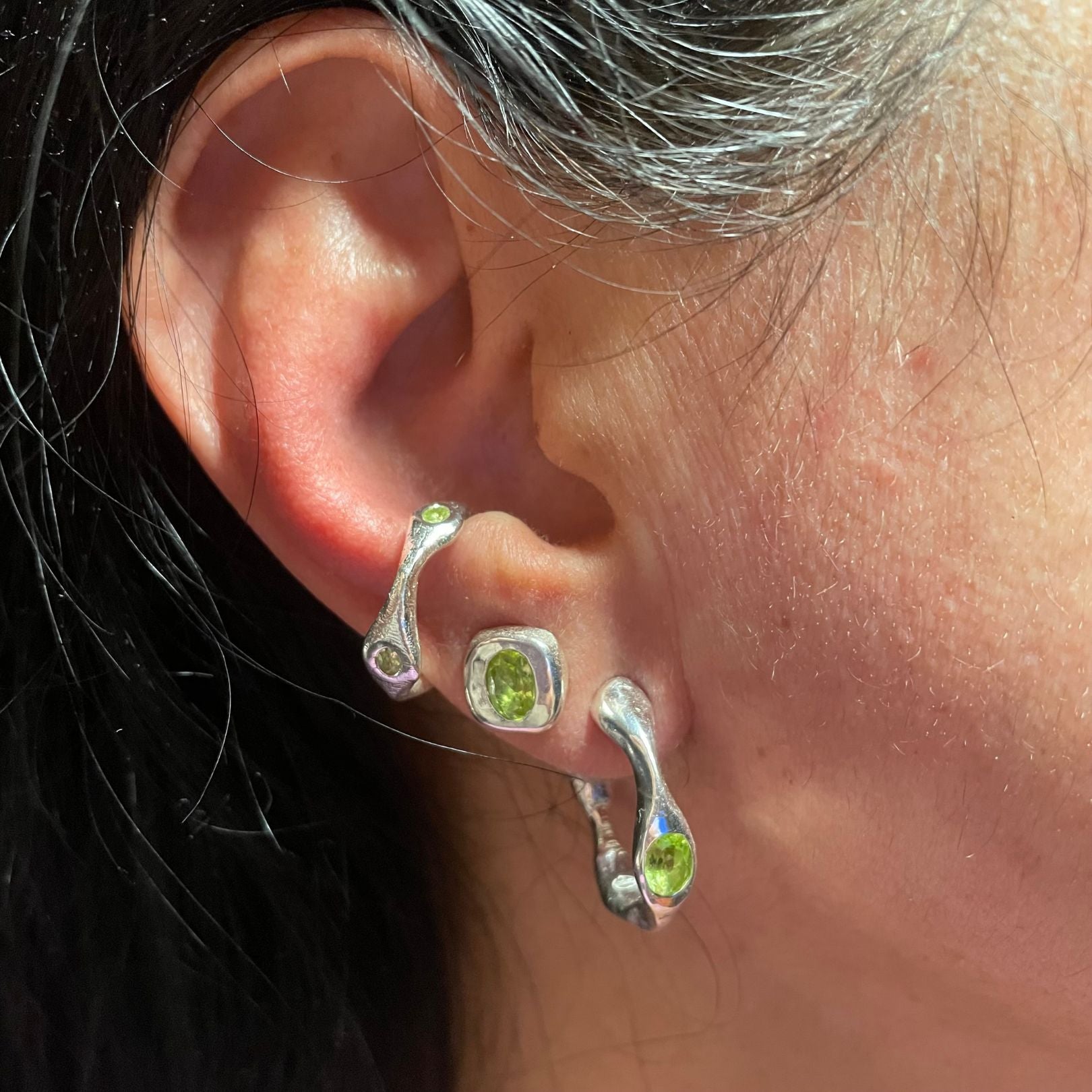 On ear, Sterling silver green peridot hoop earrings , ear cuff and studs by Amy Delson