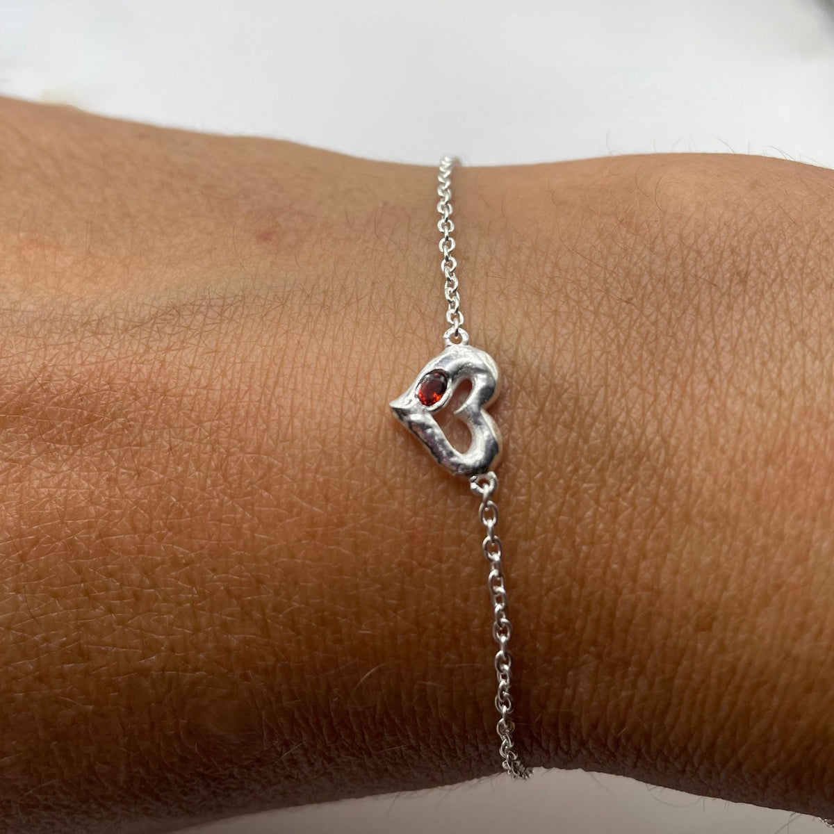 Silver garnet bracelet by Amy Delson on wrist