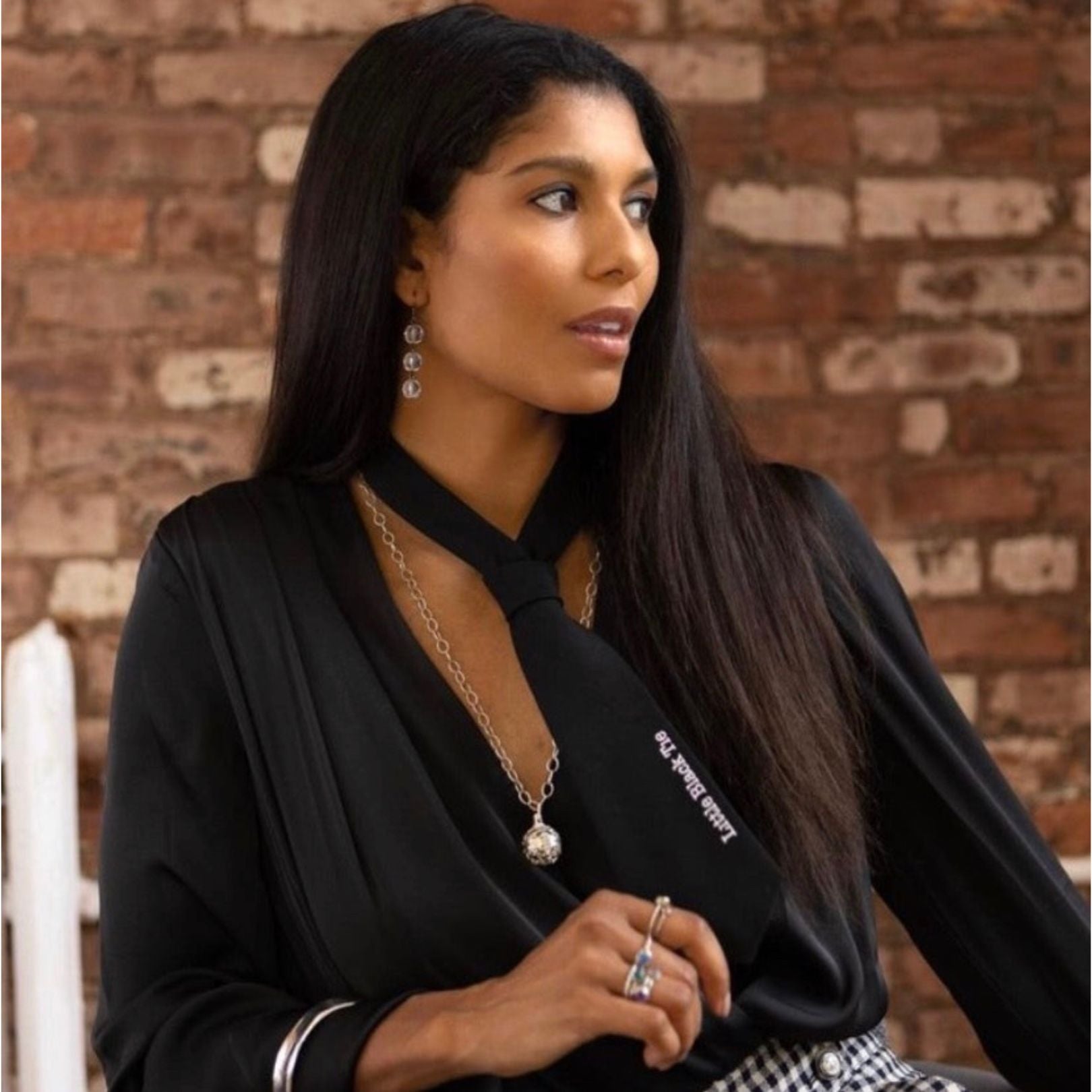 Model wears crystal earrings by Amy Delson, rings and necklace by Amy Delson