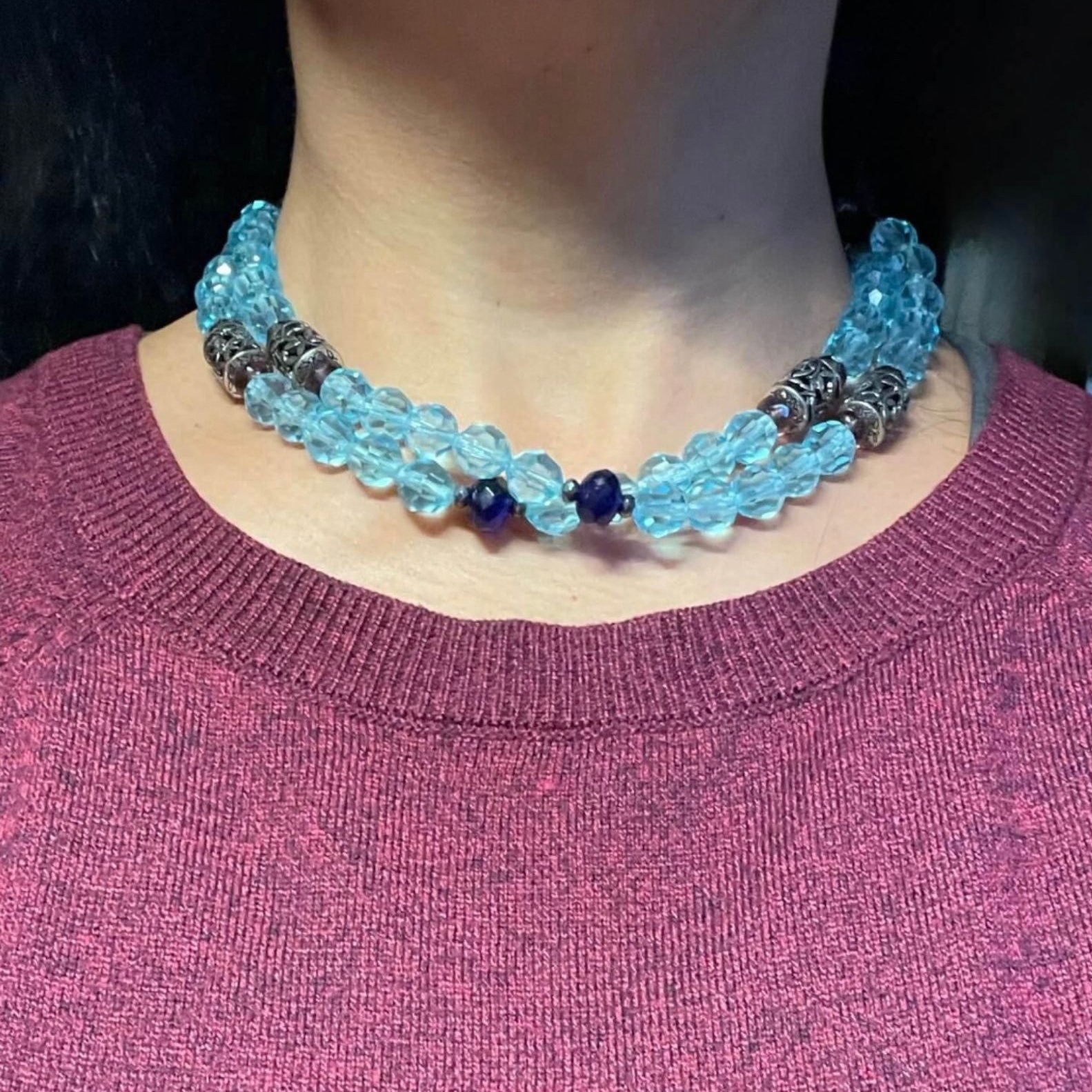 Blue crystal necklace shown doubled on neck