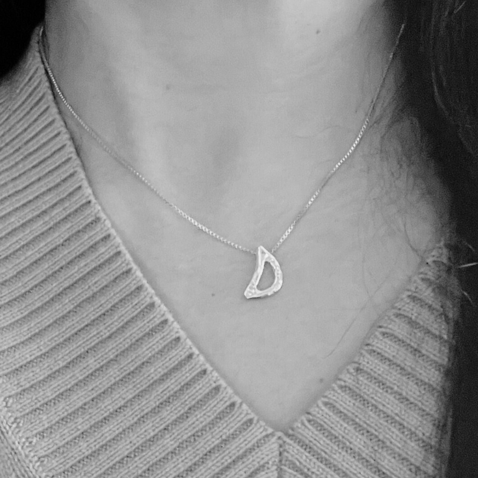model wearing white gold letter D necklace with lab diamond by Amy Delson