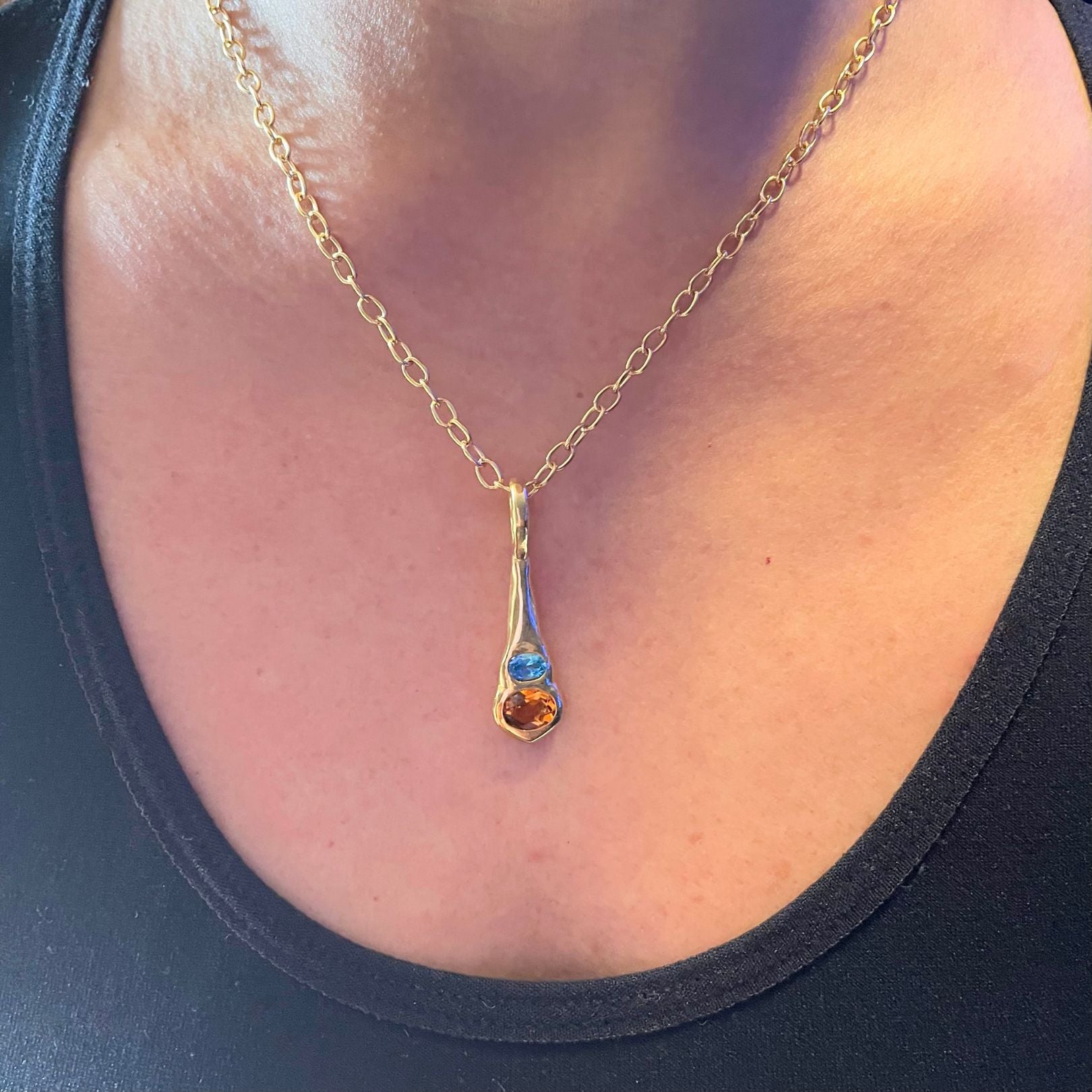 Orange citrine blue topaz necklace by Amy Delson shown on a neck