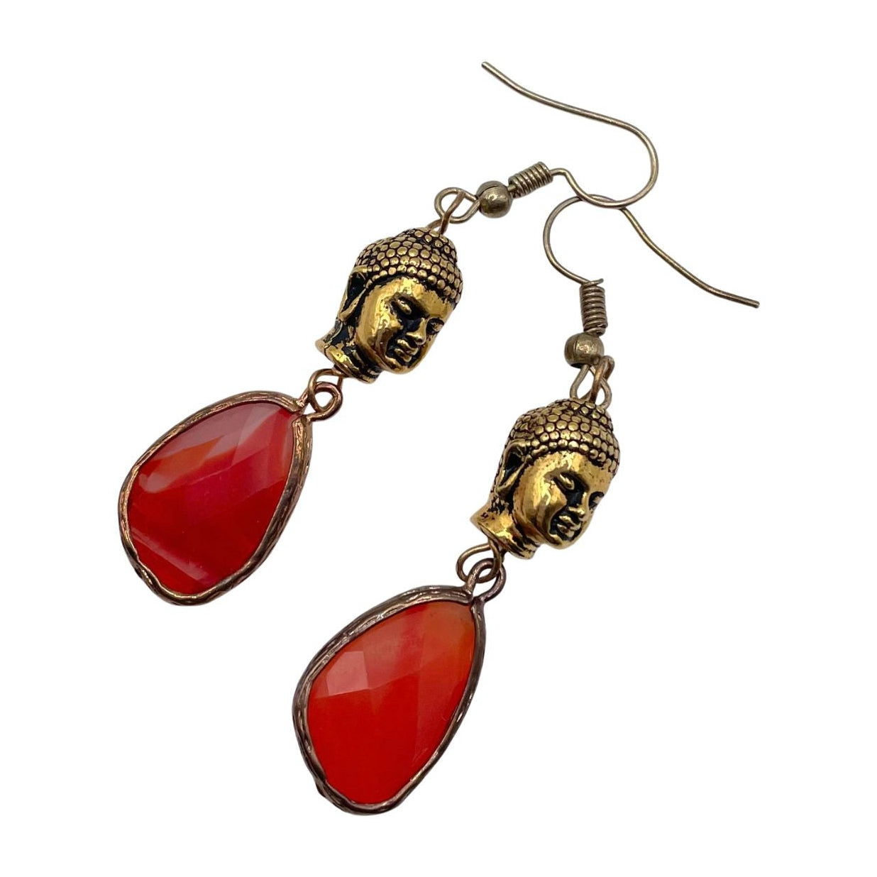 Gold and orange earrings featuring Buddha