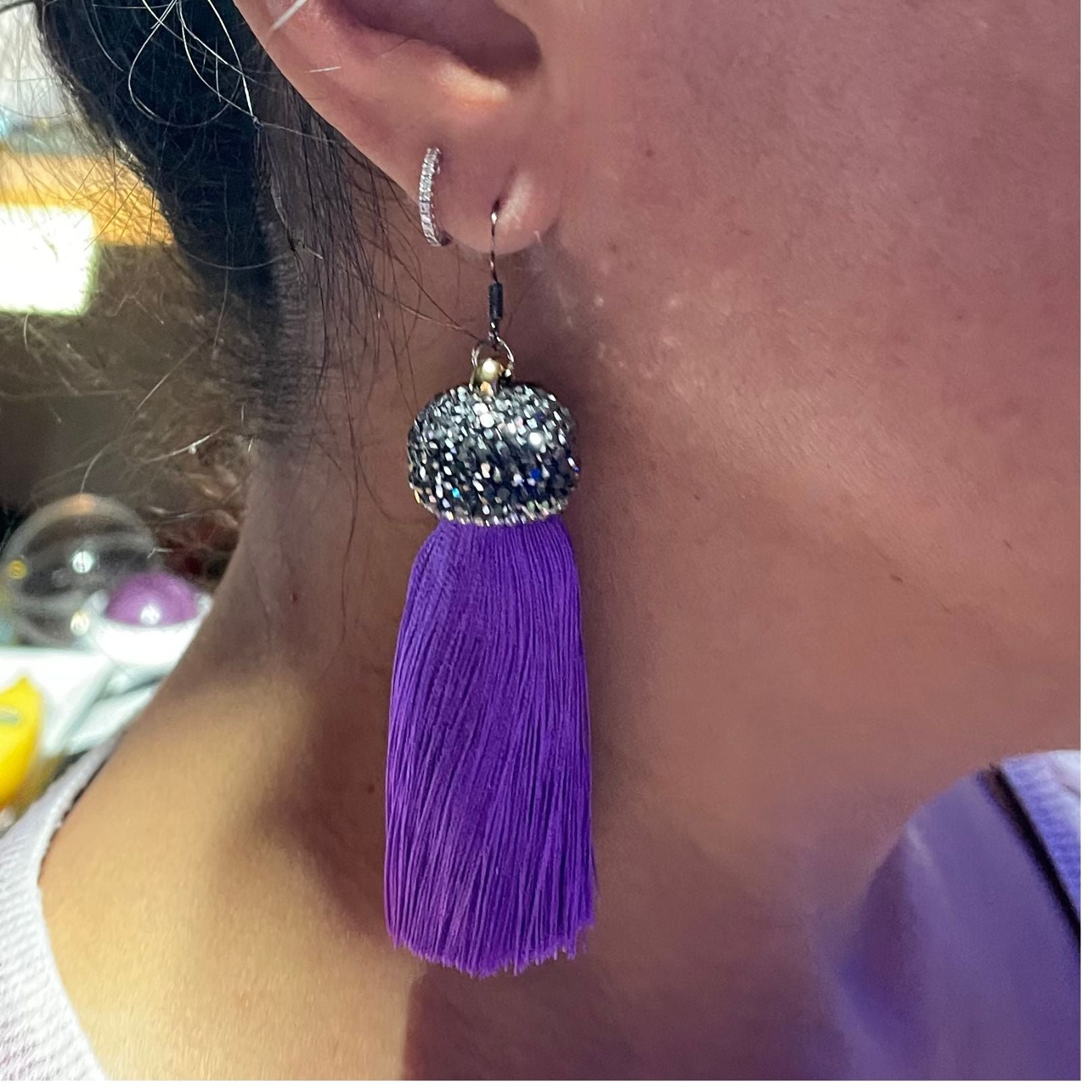 Shown on ear - Amy Delson plum tassel earrings