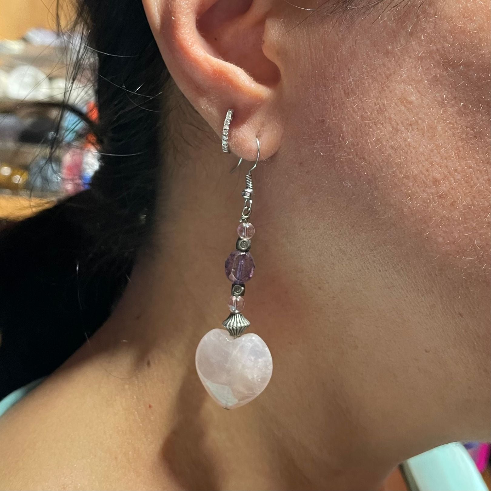 Rose quartz heart earring on ear