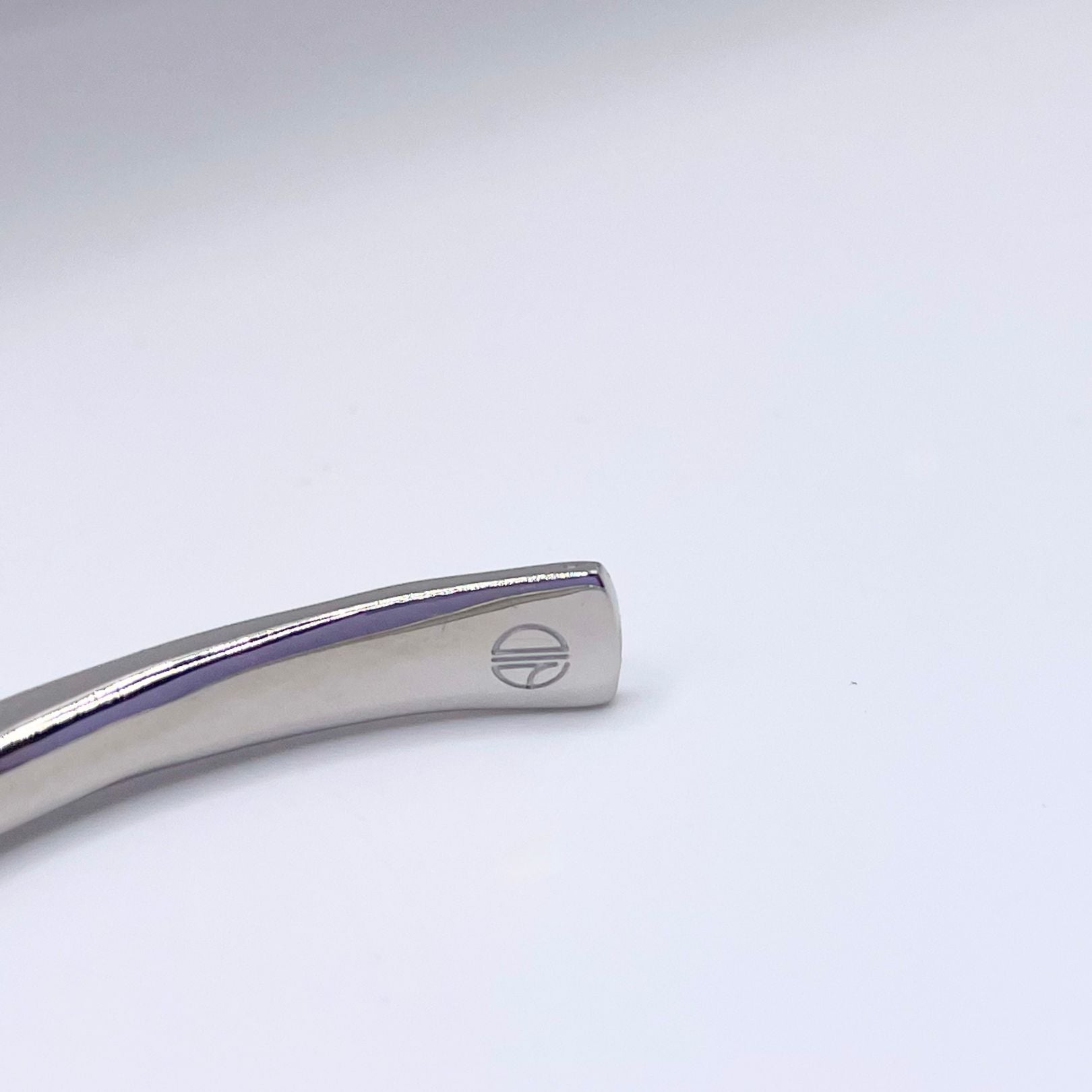 Amy Delson Jewelry logo detail inside silver cuff bracelet