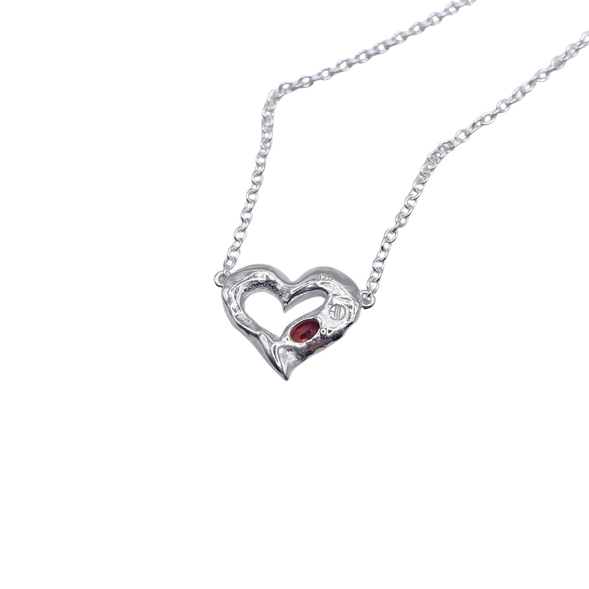 Back of silver garnet heart necklace by Amy Delson