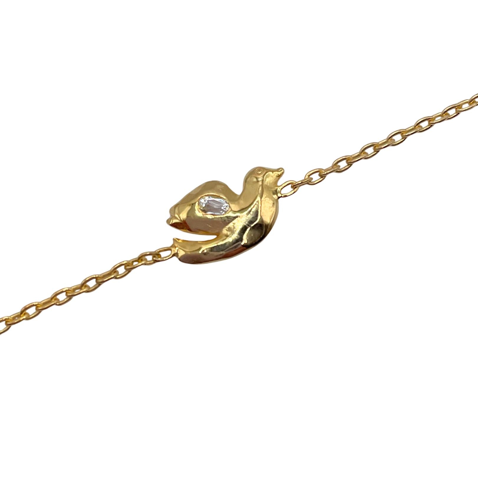 Closeup detail: 18k gold vermeil with white topaz dove bracelet by Amy Delson