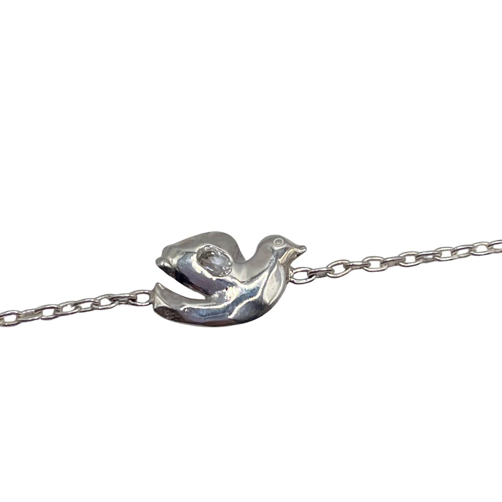 Closeup detail of Sterling Silver with white topaz dove bracelet by Amy Delson 