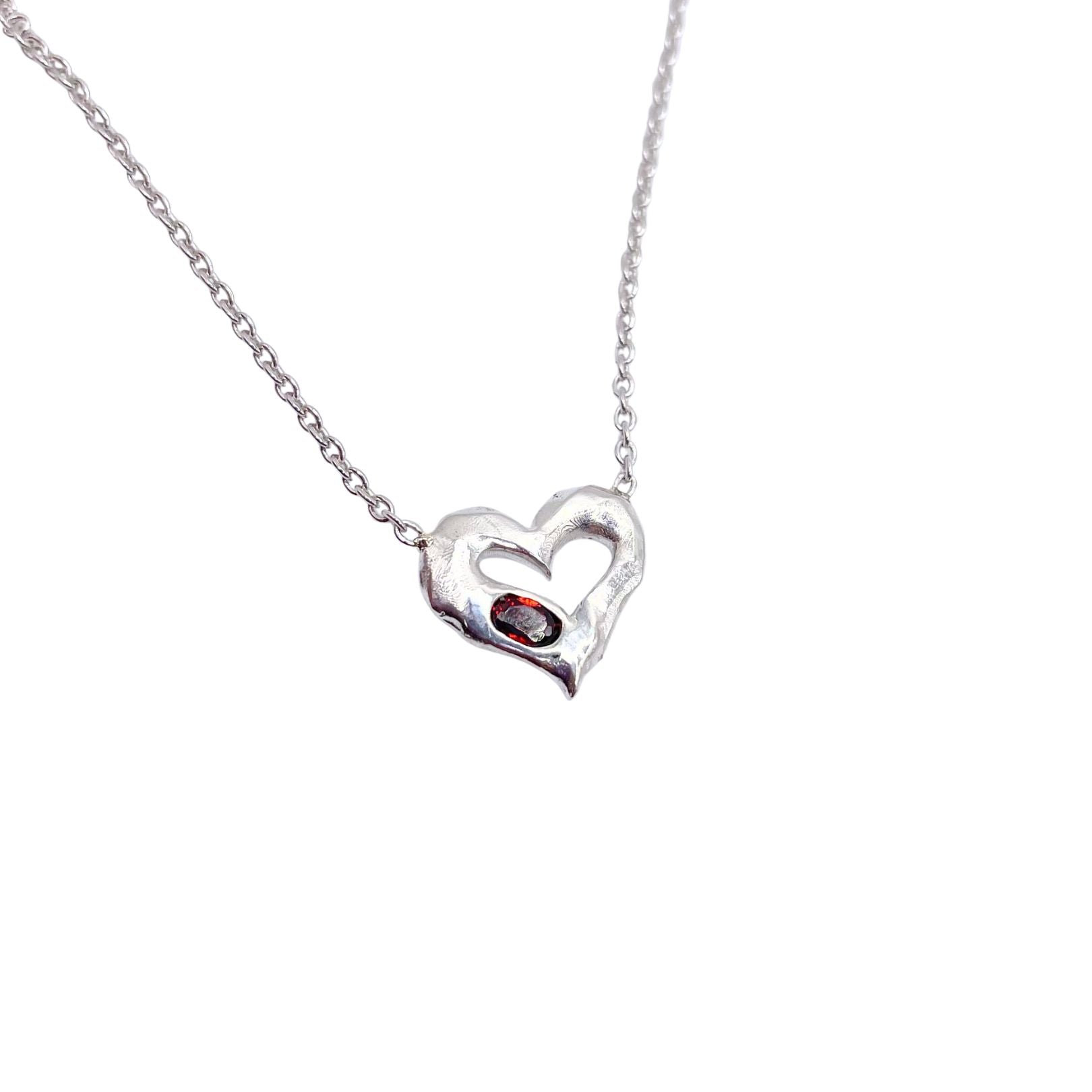 Closeup of Garnet Sterling Silver Heart Necklace by Amy Delson