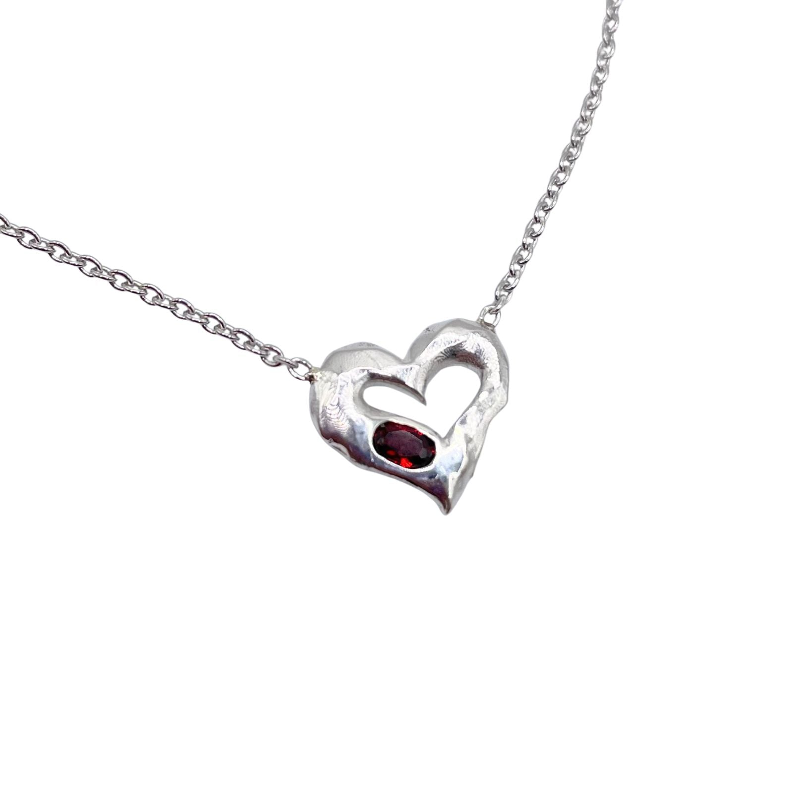 Closeup of Garnet Sterling Silver Heart Necklace by Amy Delson
