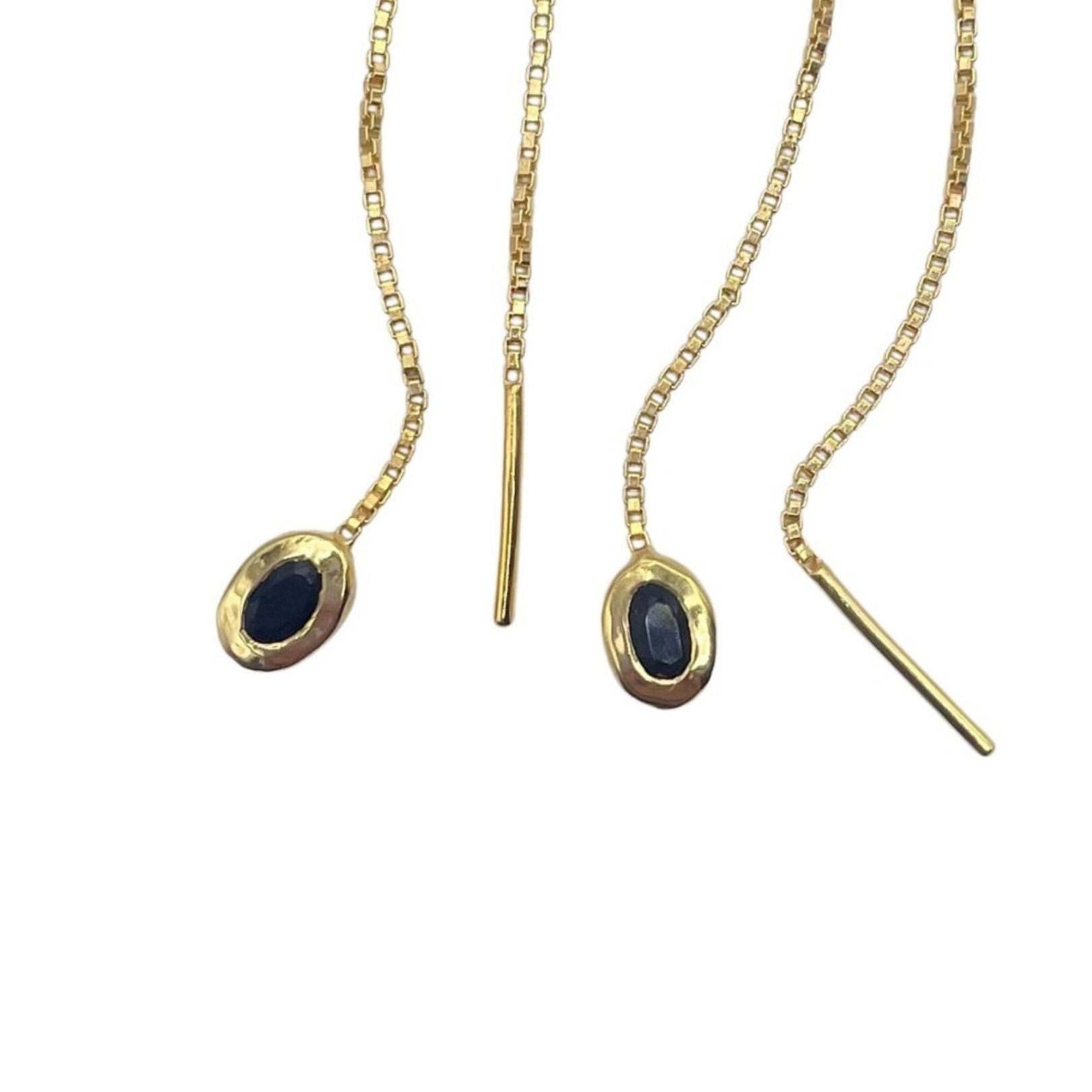Closeup of black onyx gold vermeil threaders by Amy Delson