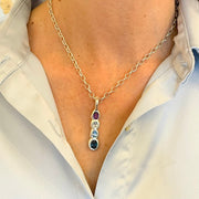 Amethyst Blue topaz pendant on model by Amy Delson