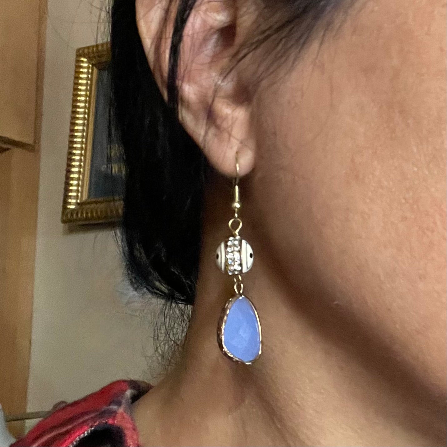 Eye earring shown on ear by Amy Delson