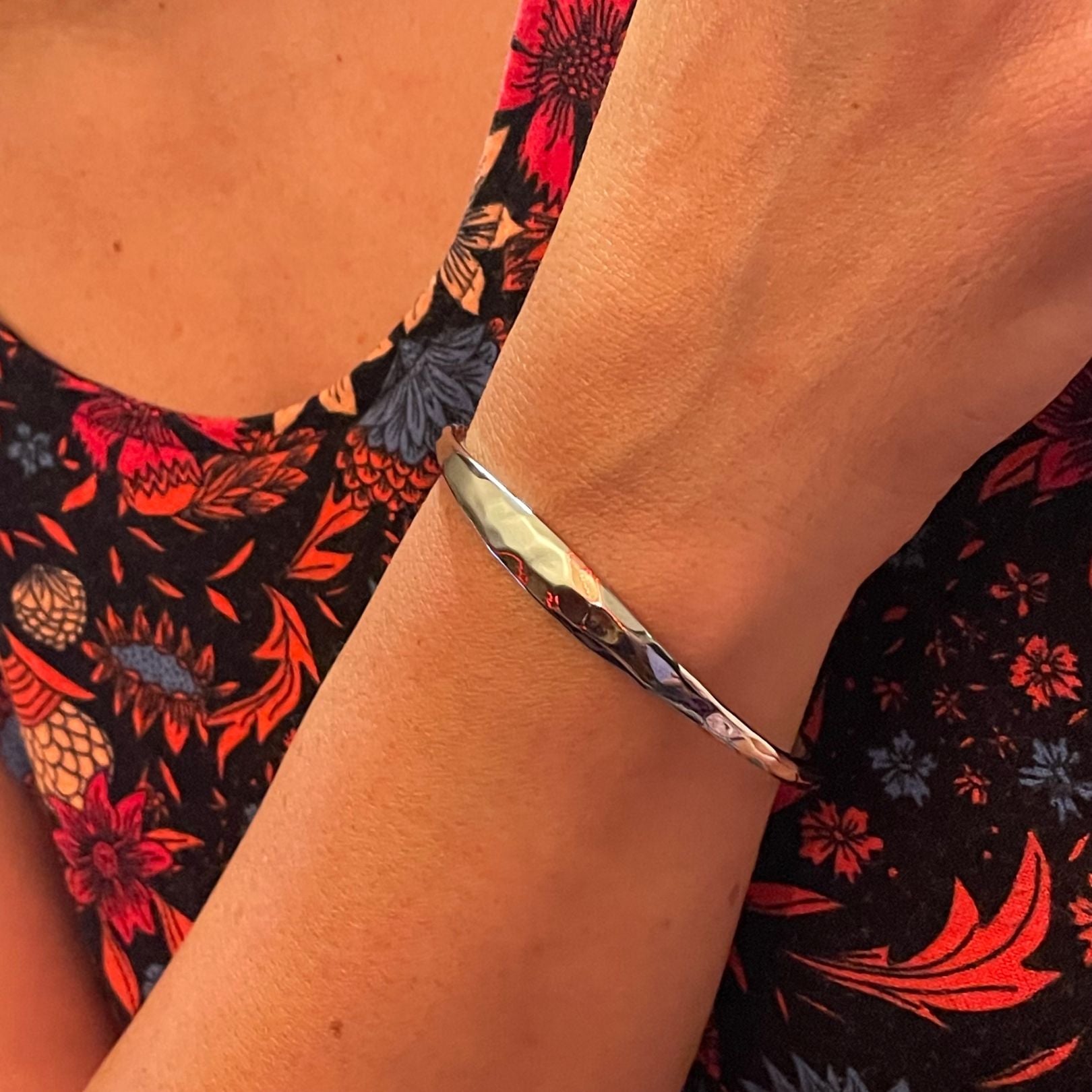 Silver forged cuff by Amy Delson shown on wrist