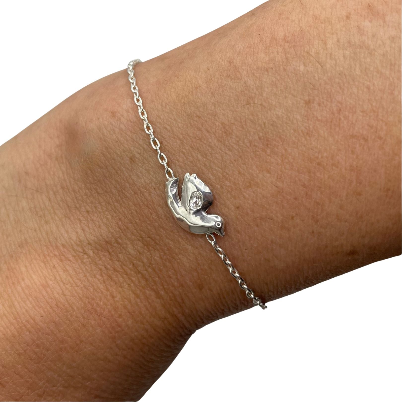 Sterling Silver with white topaz dove bracelet by Amy Delson shown on wrist