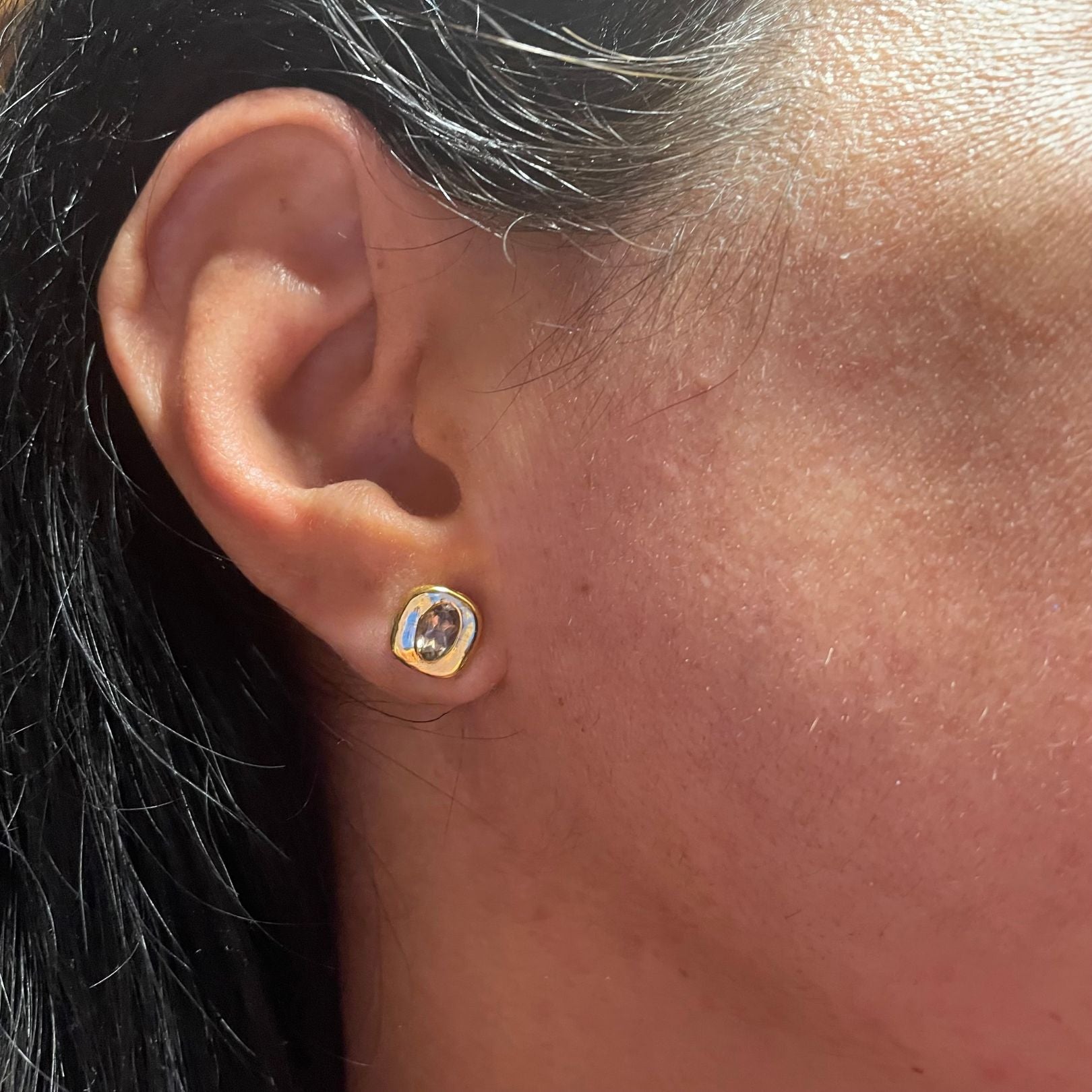 Sterling silver smoky quartz studs by Amy Delson on ear