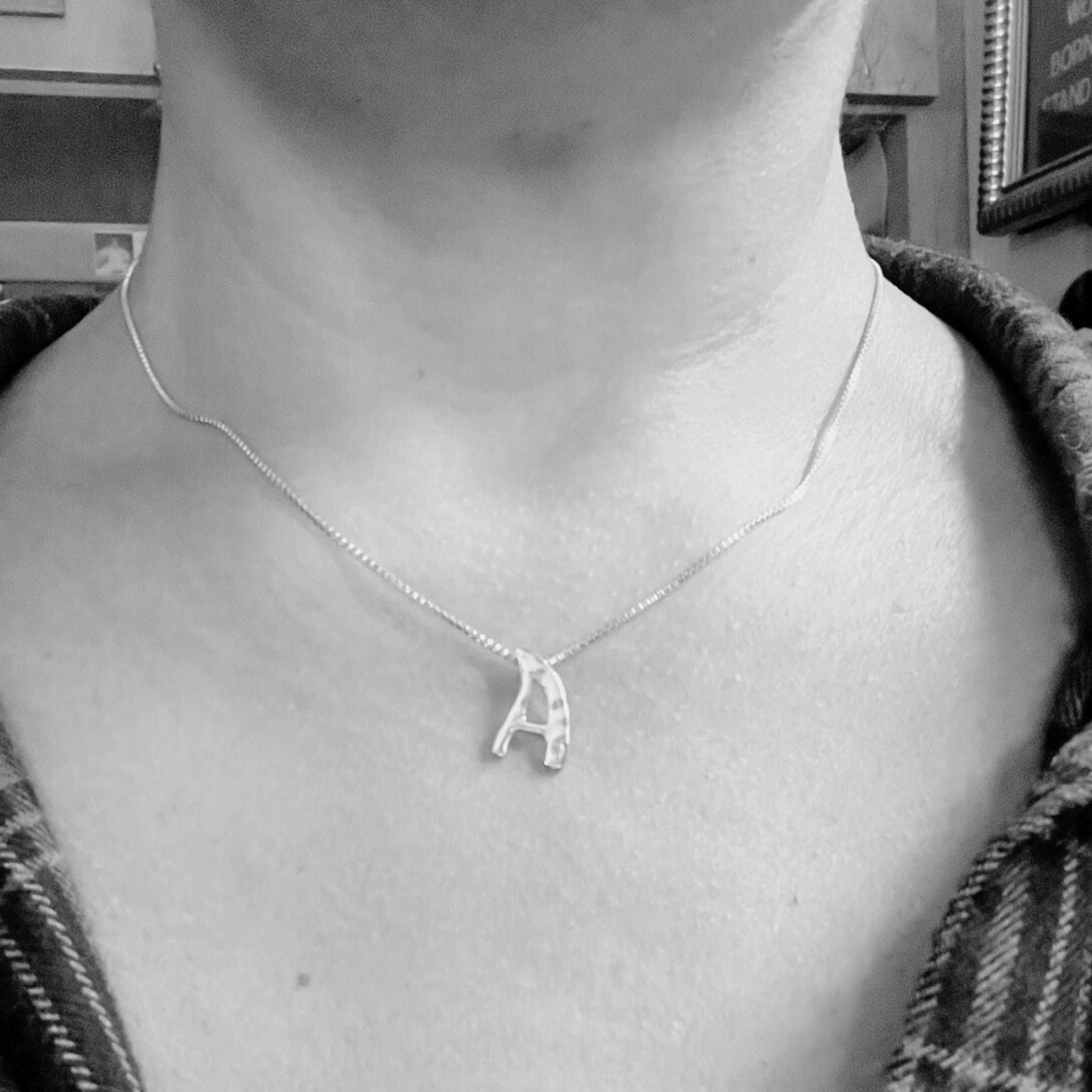 Model wearing white gold with lab diamond letter A necklace by Amy Delson