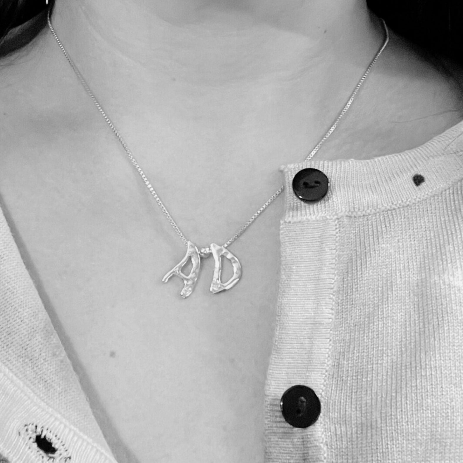 model wears Amy Delson two letter initial necklace with AD