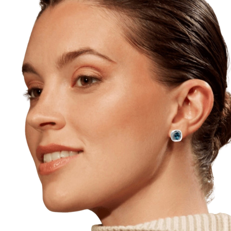 model wearing Amy Delson blue topaz sterling silver stud earring
