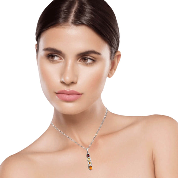 Model wears Amy Delson necklace with Garnet and citrine