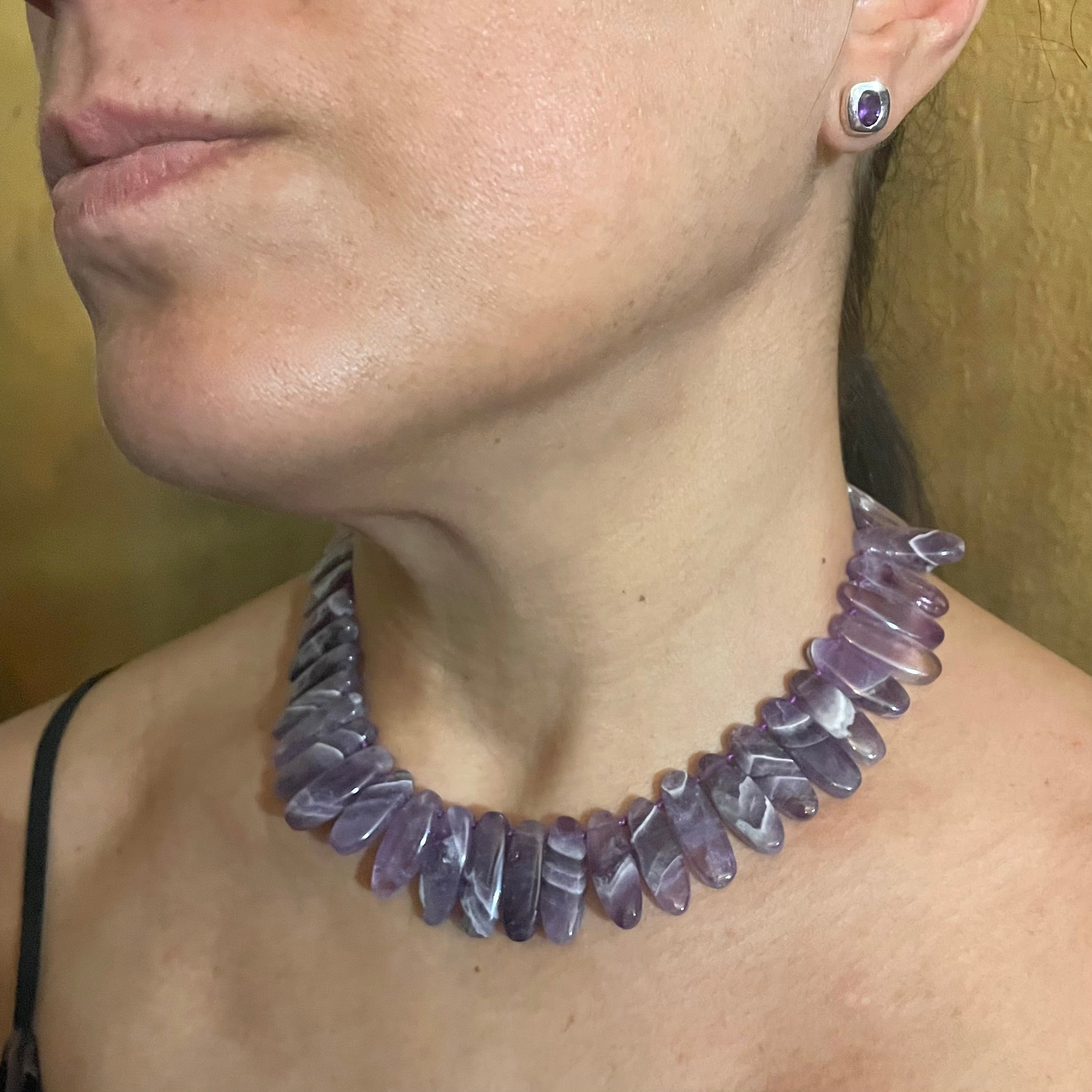 model wears Amy Delson Amethyst necklace and earrings