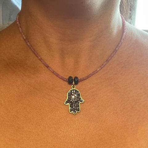 On model pink tourmaline Amy Delson hamsa necklace