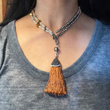 Amy Delson Brown tassel necklace worn as choker