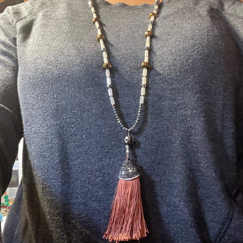 Amy Delson Brown tassel necklace on model