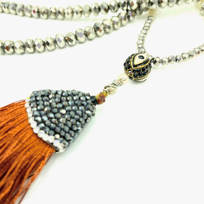 closeup Amy Delson Tassel Evil Eye necklace