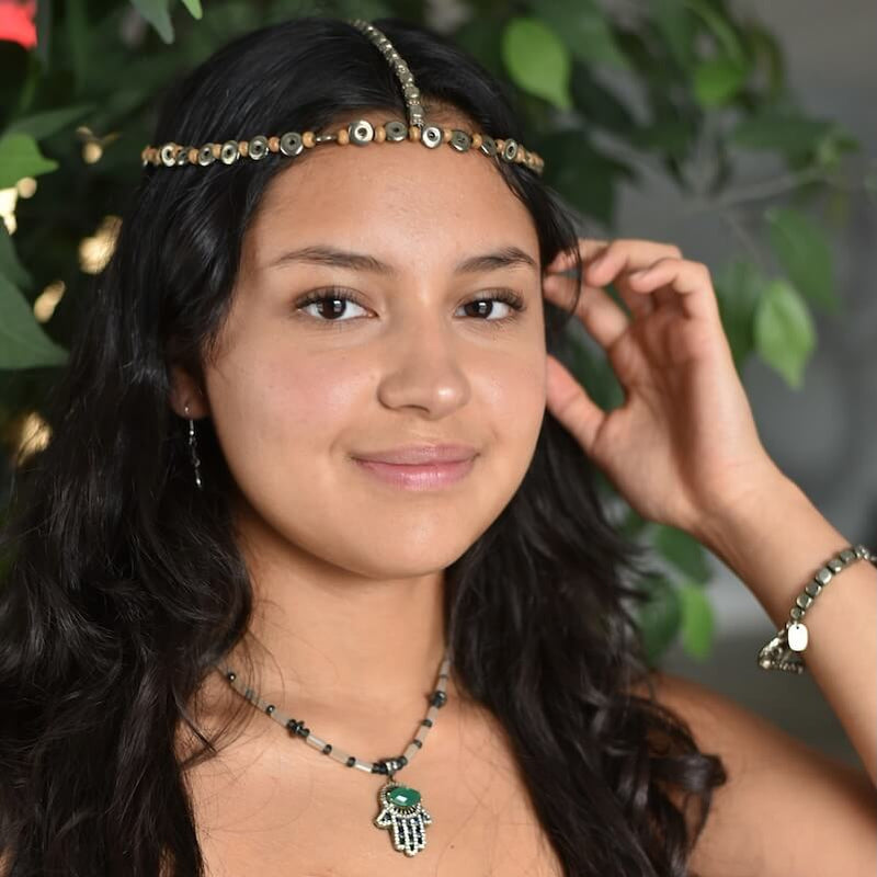 Model wearing Amy Delson Jewelry Headdress, Necklace and bracelet