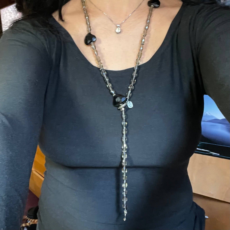 Amy Delson black hearts necklace worn as a Y